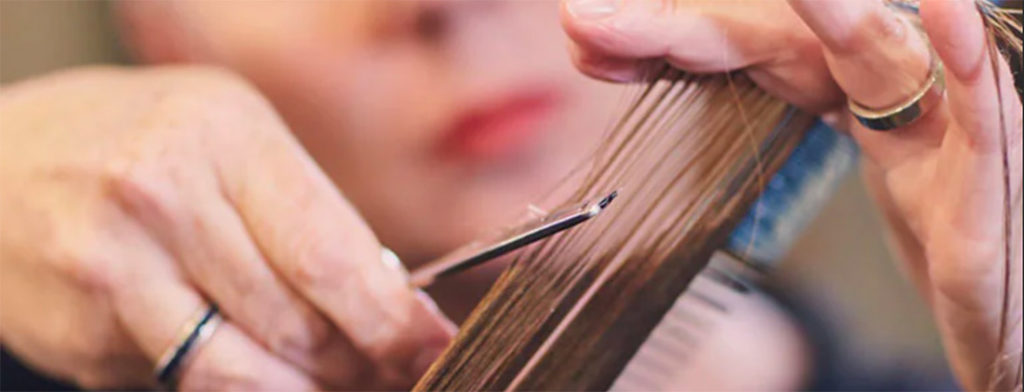 Master stylist cutting hair at Aveda 2545 Hair Salon and Spa, with locations in Gibsons and Sechelt.